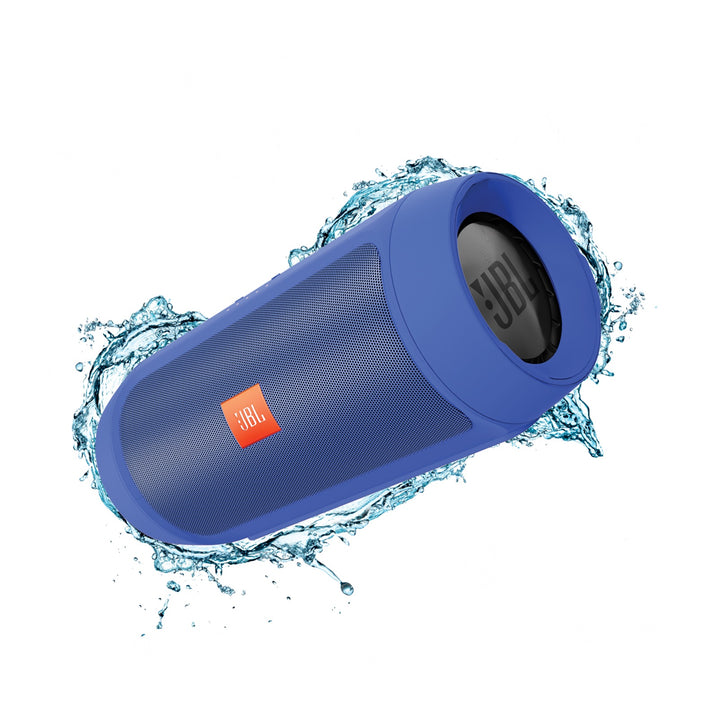 Blue JBL speaker with water splashes on a white background