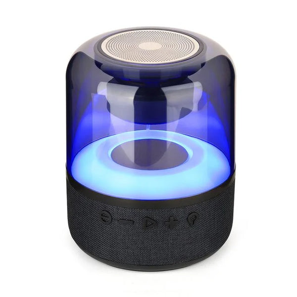 Black cylindrical speaker with blue light on a white background